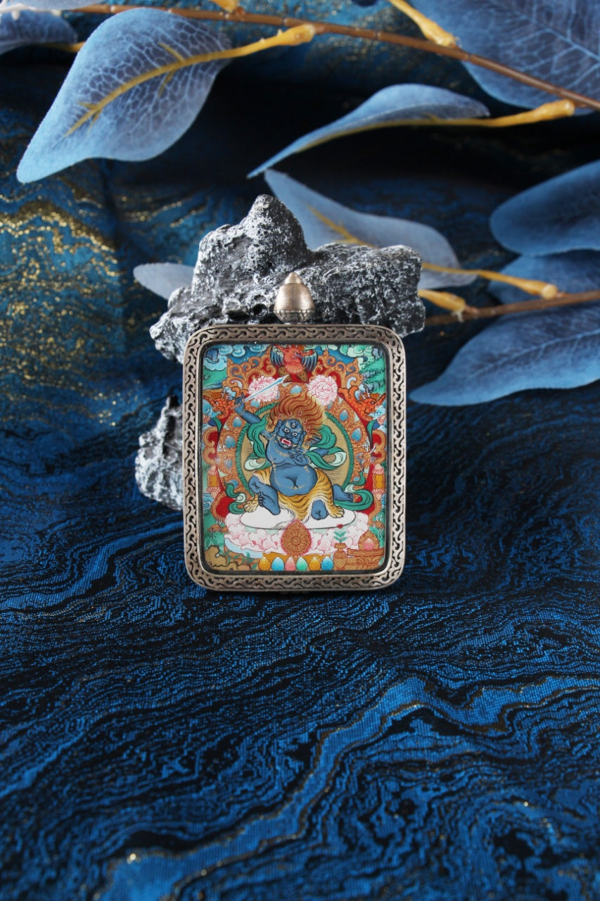 A collector-grade 4x5cm hand-painted Acala (Budong Mingwang) Thangka in Menri style, featuring the Immovable Lord in a silver Nine-Colored Deer frame.