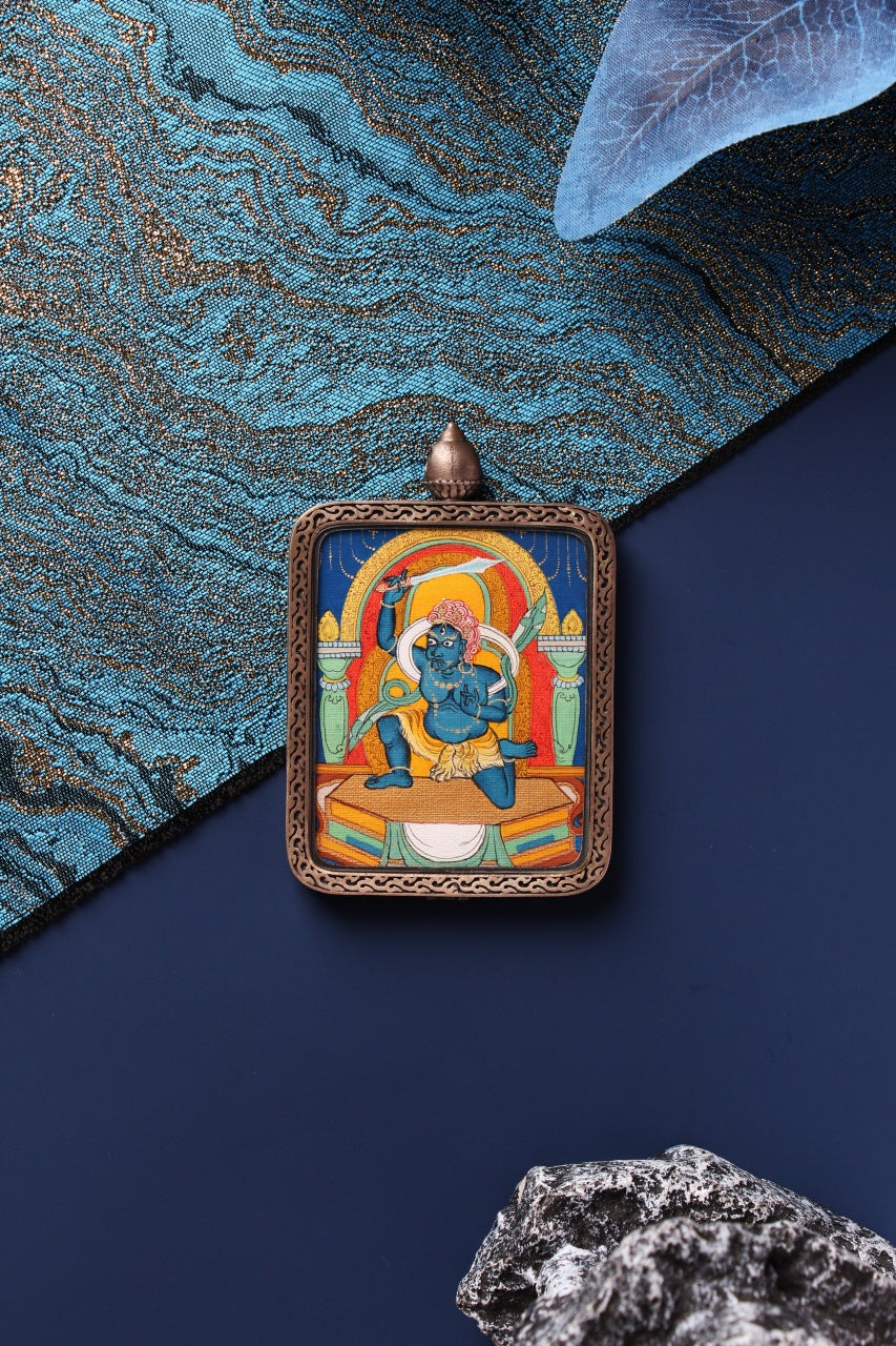 A 4x5cm hand-painted Acala (Budong Mingwang) Thangka in Chigang style, encased in a silver Nine-Colored Deer frame from Tibet.