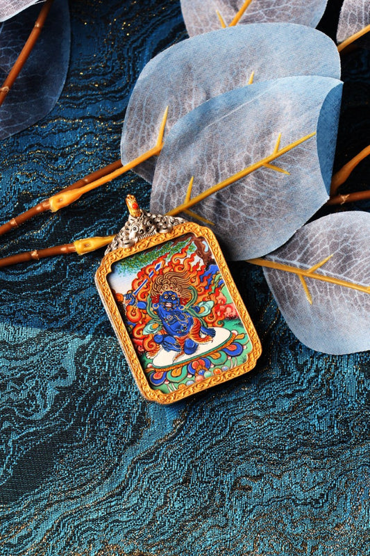 The complete Acala Buddha Thangka pendant as a sacred heirloom, showcasing the dynamic Rebgong artistry and premium electroplated silver casing.