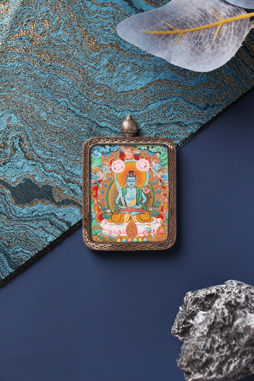 A 4x5cm hand-painted Akasagarbha (Xukongzang) Thangka in Menri style, featuring the Bodhisattva of Boundless Space in a silver Nine-Colored Deer frame.