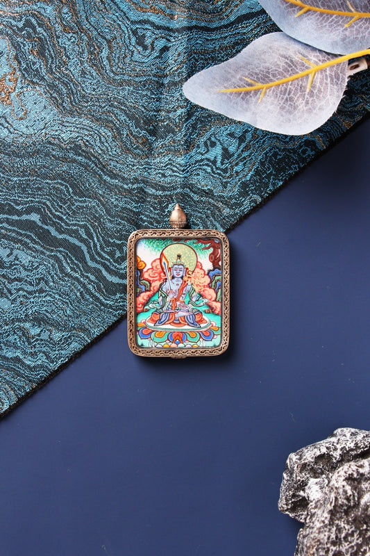 A 4x5cm hand-painted Akasagarbha Bodhisattva Thangka in Chigang style, the wealth deity for Zodiac Ox and Tiger, in a silver Nine-Colored Deer frame.