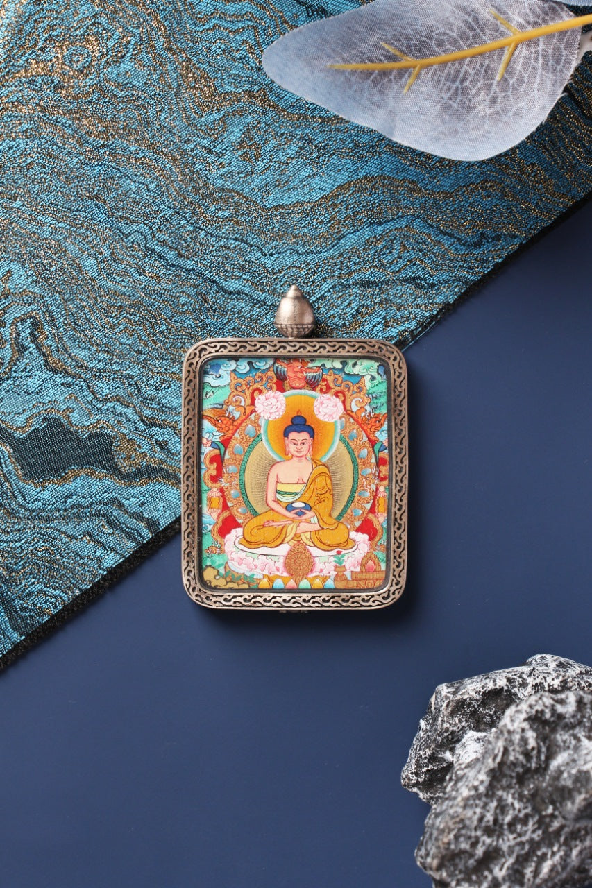 A collector-grade 4x5cm hand-painted Amitabha Buddha Thangka in Menri style, featuring the Lord of Infinite Light in a silver Nine-Colored Deer frame.