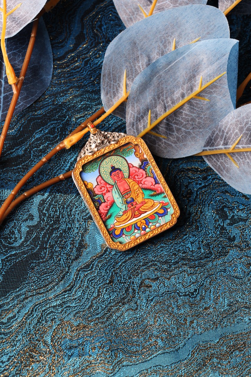 A 3.5x4.5cm high-end hand-painted Amitabha Buddha Thangka from Rebgong, the guardian for Zodiac Dog and Pig, in a silver protective frame.