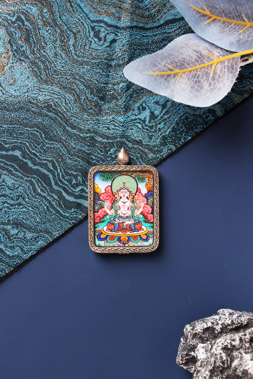 A 3.5x4.5cm high-end hand-painted Four-Armed Chenrezig (Guan Yin) Thangka from Rebgong in a Dunhuang Nine-Colored Deer Sterling Silver frame.
