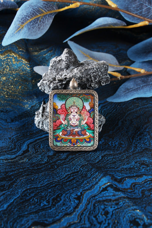 Detailed close-up of the Four-Armed Avalokiteshvara Thangka core, highlighting the prayer mudra, crystal mala, and the artist's fine gold-line work.