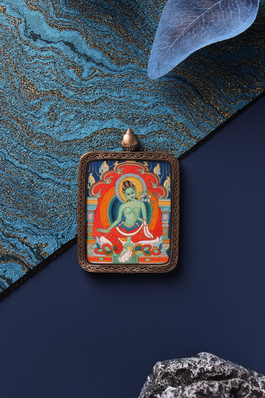 A 4x5cm hand-painted Green Tara (Dolma) Thangka in Chigang style, in a silver Nine-Colored Deer frame.