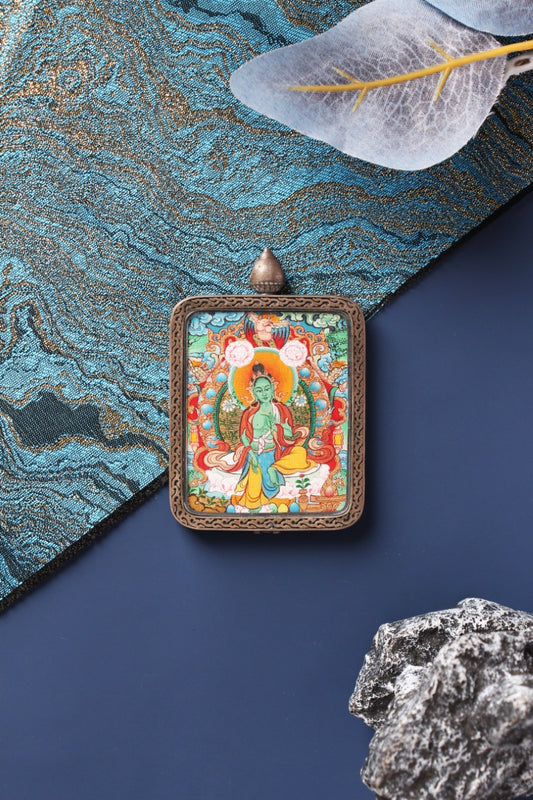 Detailed view of the S925 silver casing with Dunhuang Nine-Colored Deer relief, protecting the Green Tara artwork.