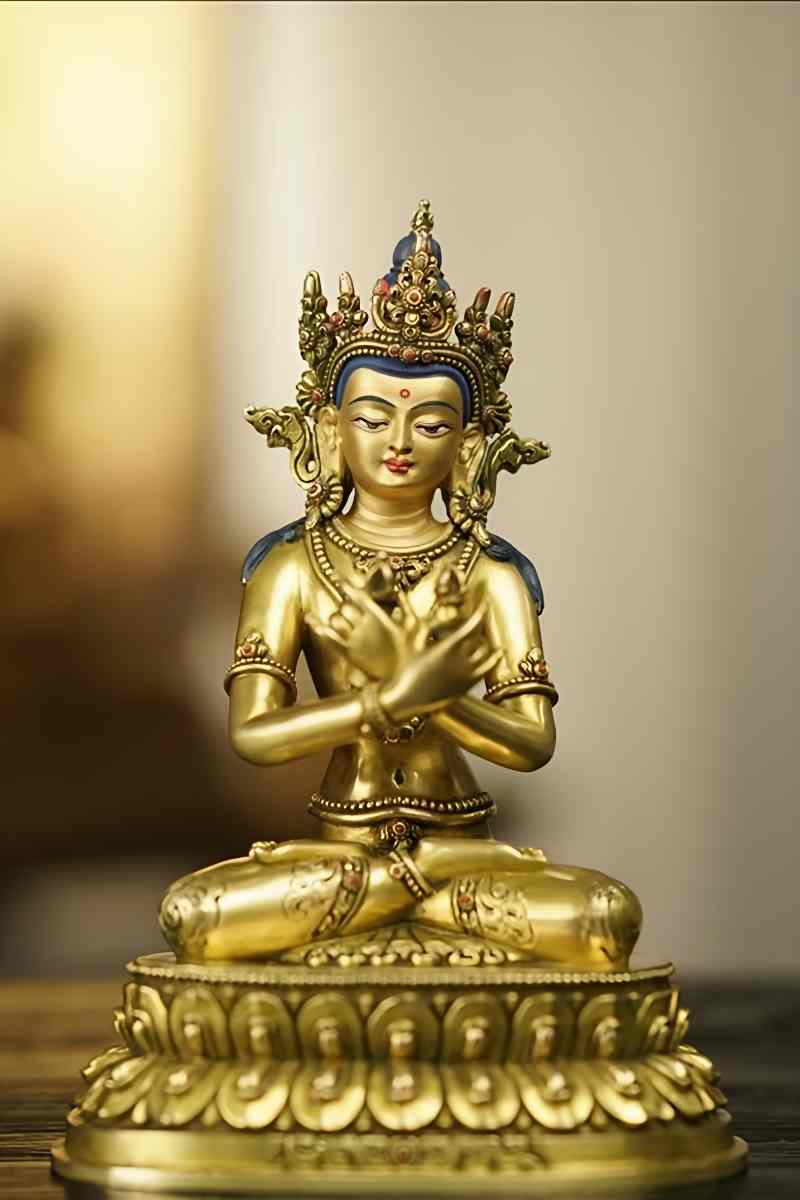 Exquisite Tibetan Buddhist statue of Vajradhara, crafted from brass with a gold gilt finish, showcasing intricate handmade details in Buddhist art.