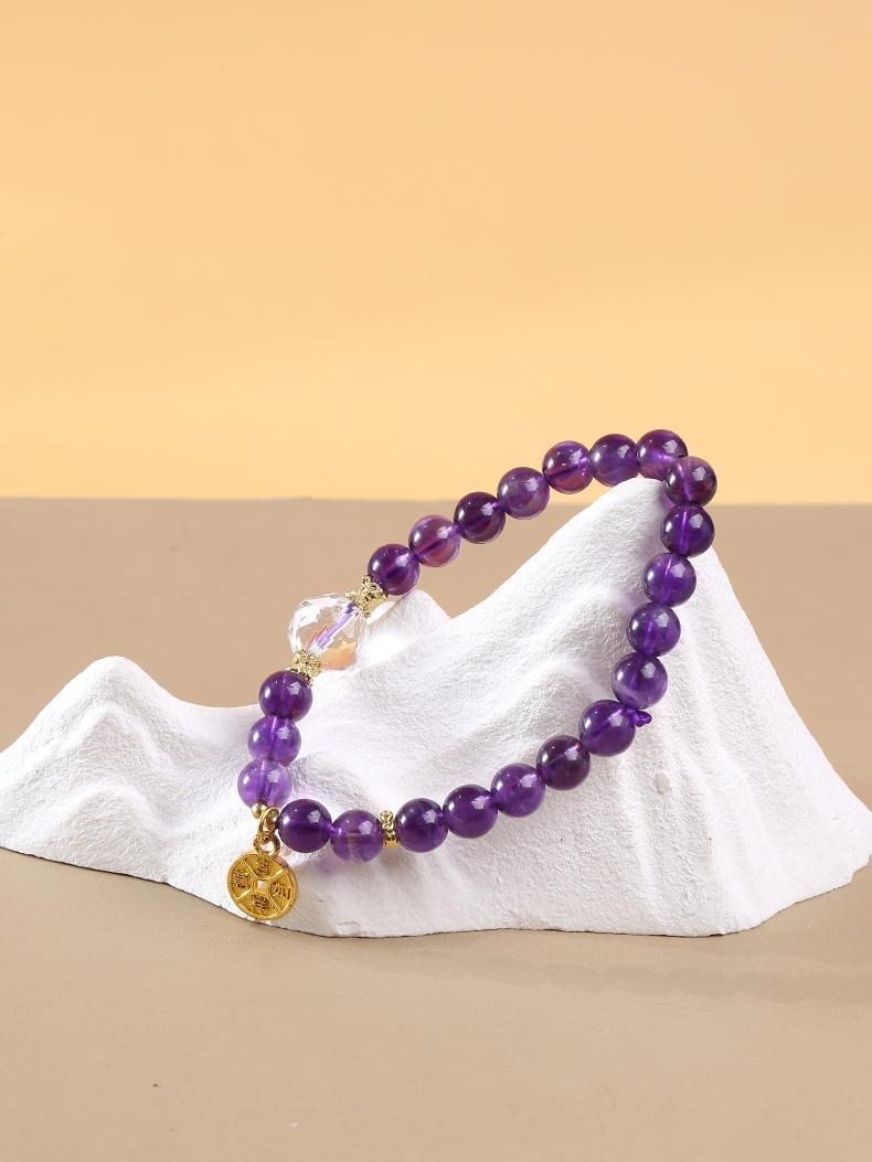 Handmade amethyst bead bracelet inspired by Tibetan Buddhist Jewelry Culture, featuring intricate craftsmanship and spiritual significance for balance and healing.