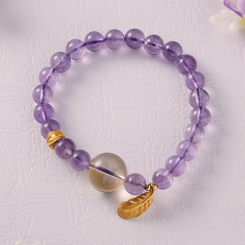 Elegant amethyst feather bracelet, combining Tibetan Buddhist symbolism with spiritual artistry, designed for peace, protection, and mindfulness.