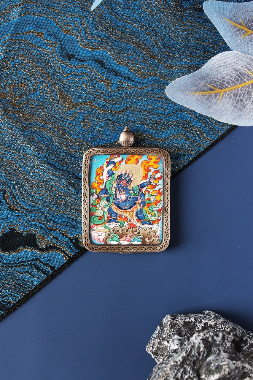 A 4x5cm hand-painted Karma Gadri style Six-Armed Mahakala Thangka from Tibet, encased in a Dunhuang Nine-Colored Deer silver frame.