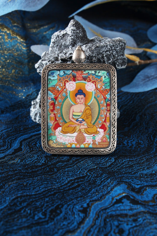 The Amitabha Buddha Thangka pendant, identified as the spiritual guardian and patron deity for those born in the Year of the Dog and Pig.