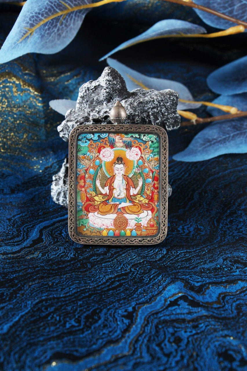 Close-up of the Chenrezig Thangka core, showing the intricate details and vibrant natural mineral colors used by Tibetan masters.