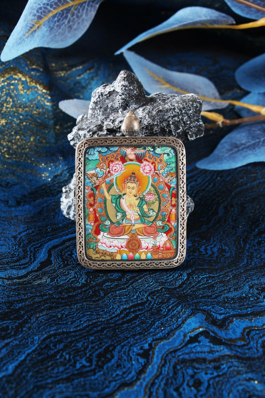 A 4x5cm hand-painted Manjushri (Wenshu) Thangka in Menri style, featuring the Bodhisattva of Wisdom in a silver Nine-Colored Deer frame.