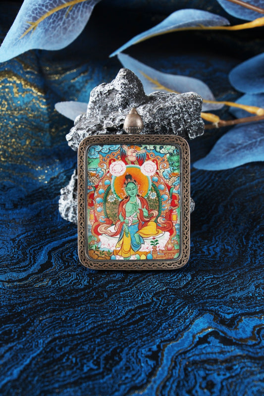 A high-end 4x5cm hand-painted Green Tara Thangka in Menri style, encased in a silver Nine-Colored Deer frame from Tibet.