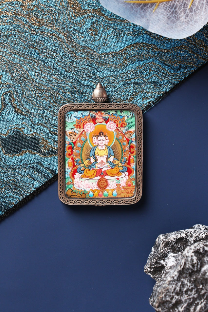 The Vairocana Buddha Thangka pendant, identified as the spiritual guardian and patron deity for those born in the Year of the Sheep and Monkey.