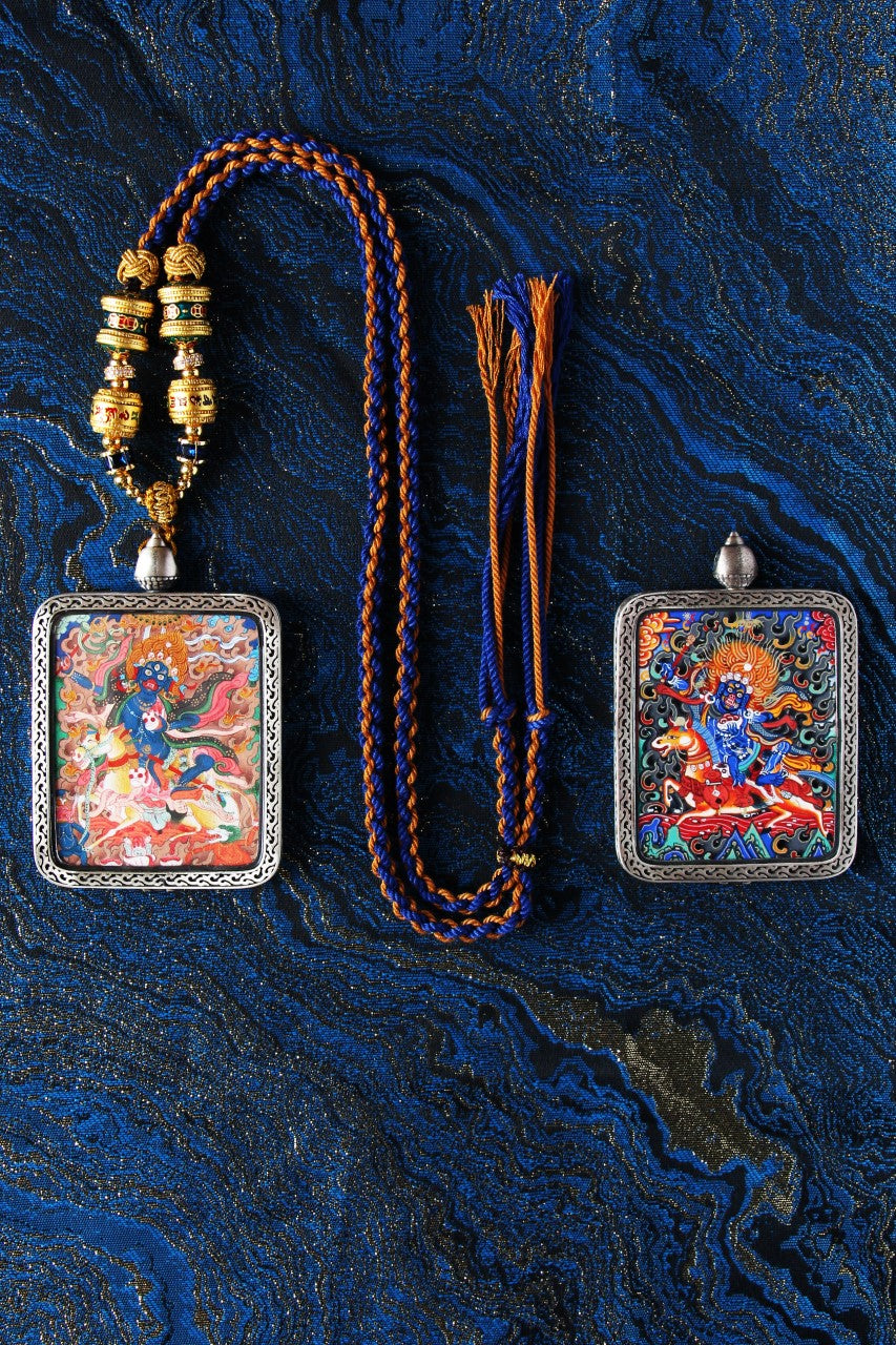 A 4x5cm hand-painted Palden Lhamo Thangka in Miansa style, featuring pure gold powder and mineral pigments in a silver frame.