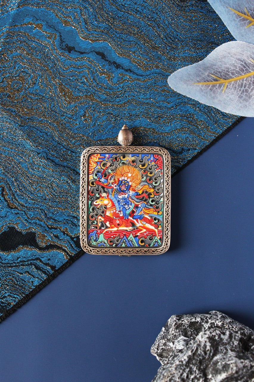 A 4x5cm hand-painted Palden Lhamo Thangka in Miansa style, featuring pure gold powder and mineral pigments in a silver frame.