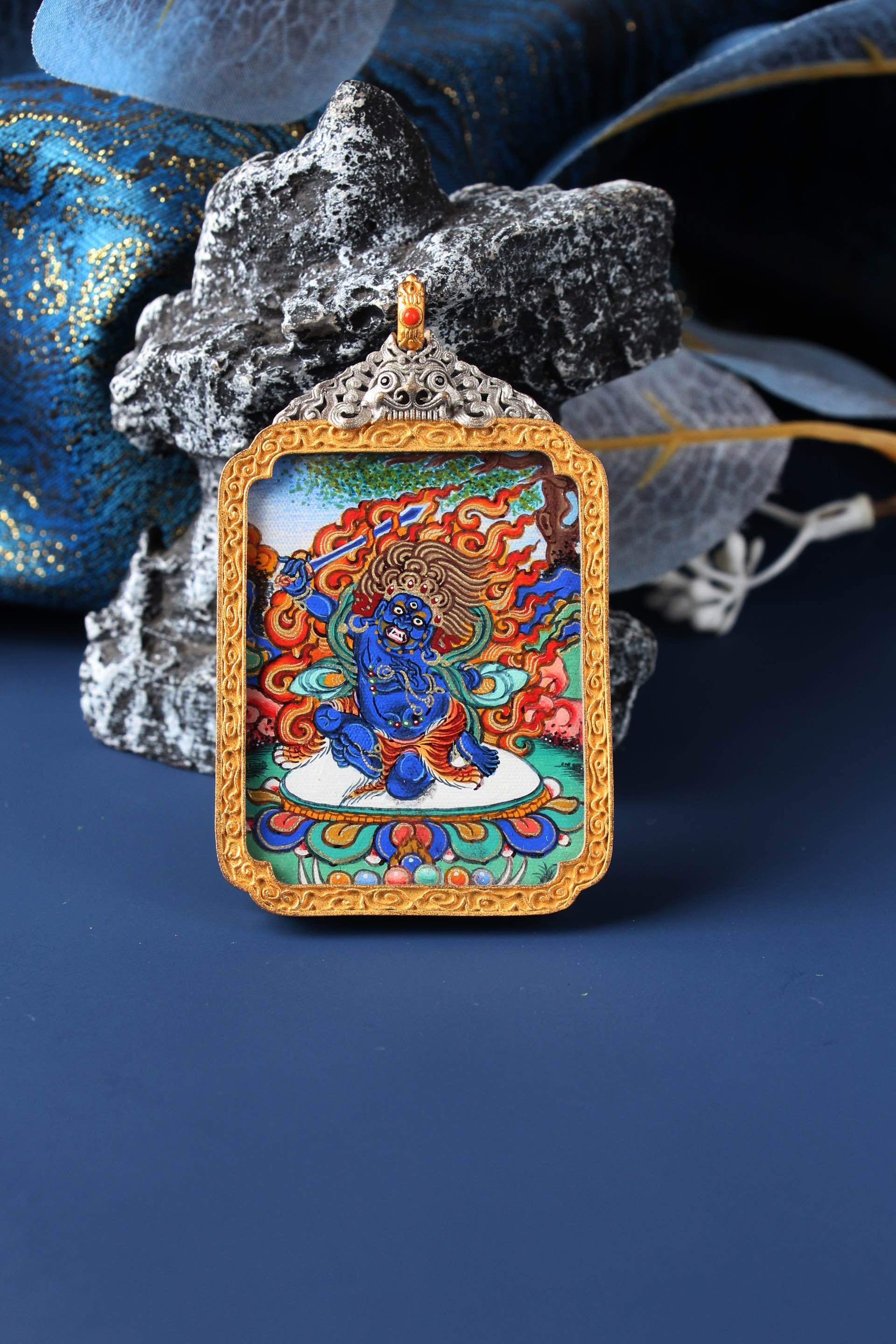 A 3.5x4.5cm high-end hand-painted Acala (Budong Mingwang) Thangka from Rebgong, the guardian for Zodiac Rooster, in a silver protective frame.