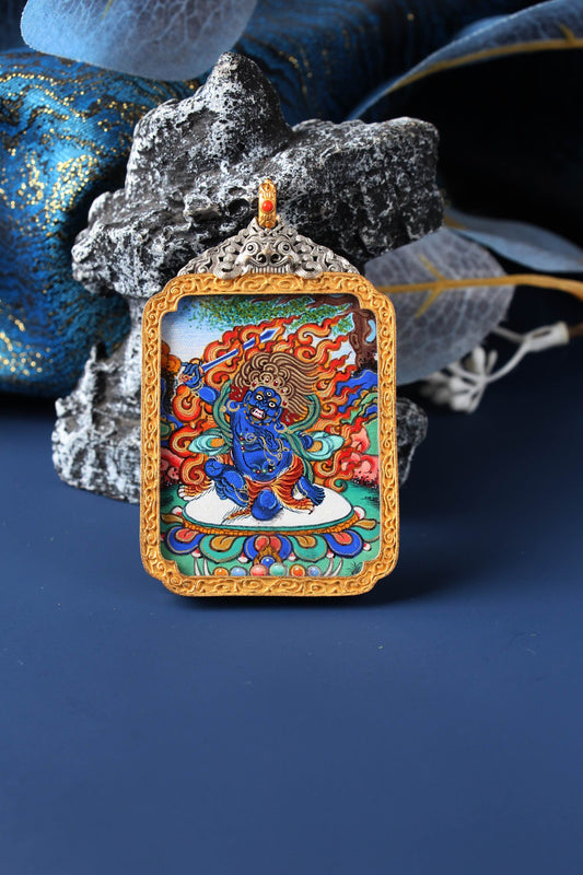 A 3.5x4.5cm high-end hand-painted Acala (Budong Mingwang) Thangka from Rebgong, the guardian for Zodiac Rooster, in a silver protective frame.