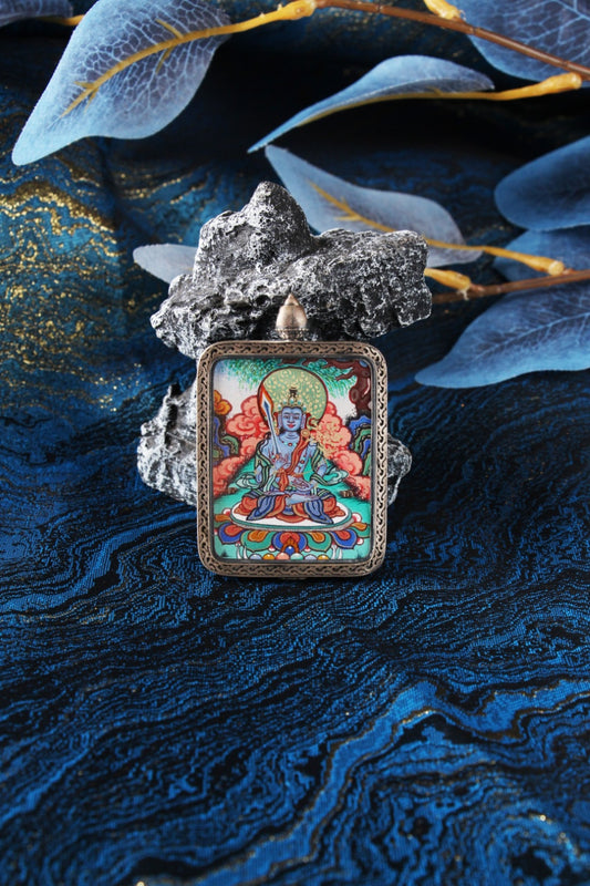 Close-up of the bespoke Sterling Silver casing featuring the auspicious Nine-Colored Deer motif from Dunhuang, protecting the Rebgong Thangka.