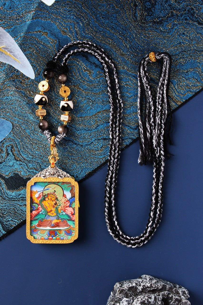 Detailed close-up of the Manjushri Thangka core, highlighting the flaming sword of wisdom and the master Lama artist's gold-line detail.