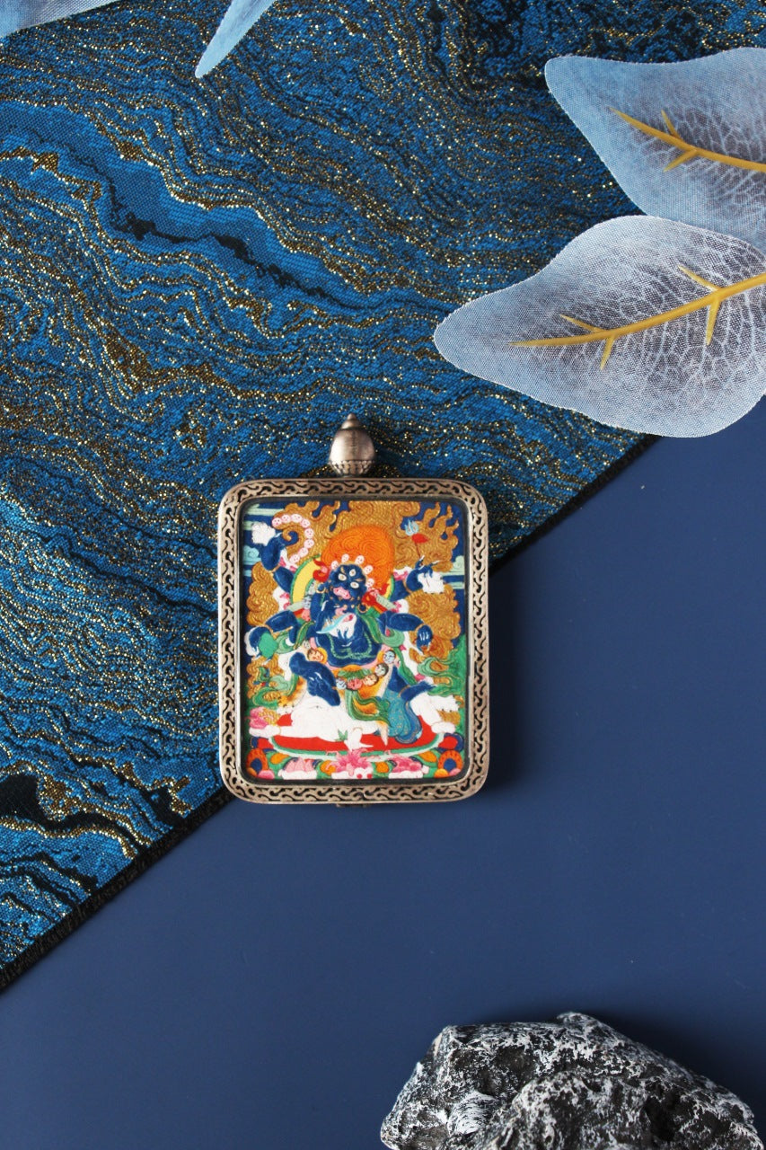 Intricate relief of the Nine-Colored Deer on the Sterling Silver casing used for the premium Mahakala Thangka pendant.