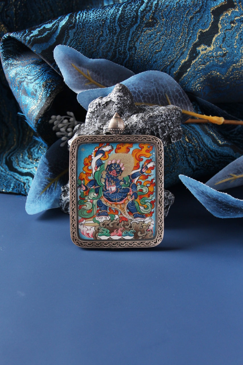 Micro-detail of the Six-Armed Mahakala showing the delicate linework and natural mineral pigments of the Karma Gadri school.