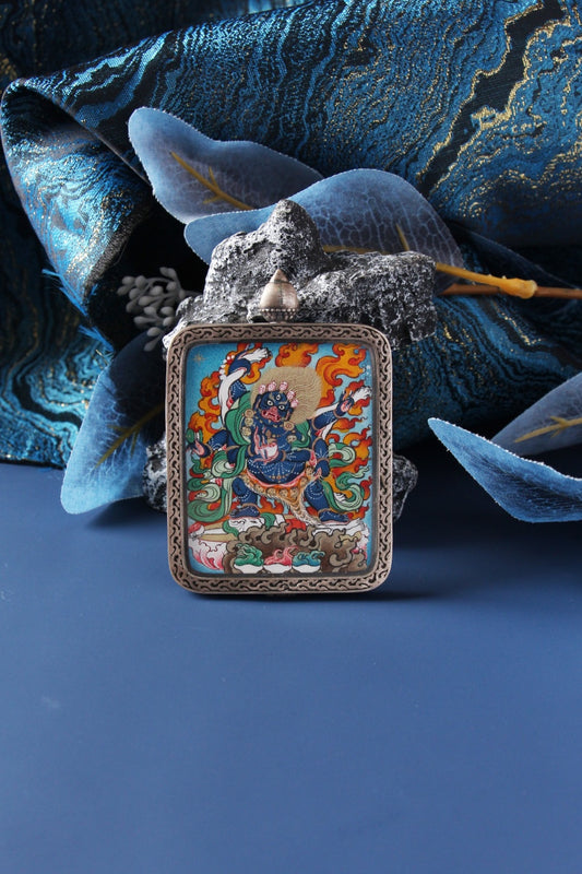 Micro-detail of the Six-Armed Mahakala showing the delicate linework and natural mineral pigments of the Karma Gadri school.