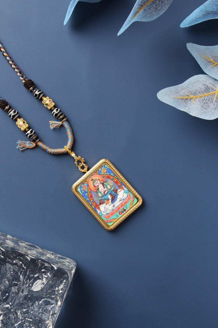  Close-up of a hand-painted Rebgong Manjushri Thangka showing the delicate gold powder and mineral pigment artistry.
