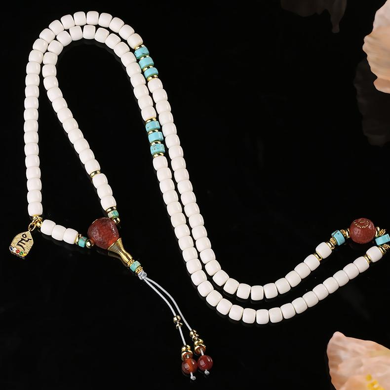 Tibetan Buddhist 108 beads bone necklace featuring red agate three-way connector and brass ornaments