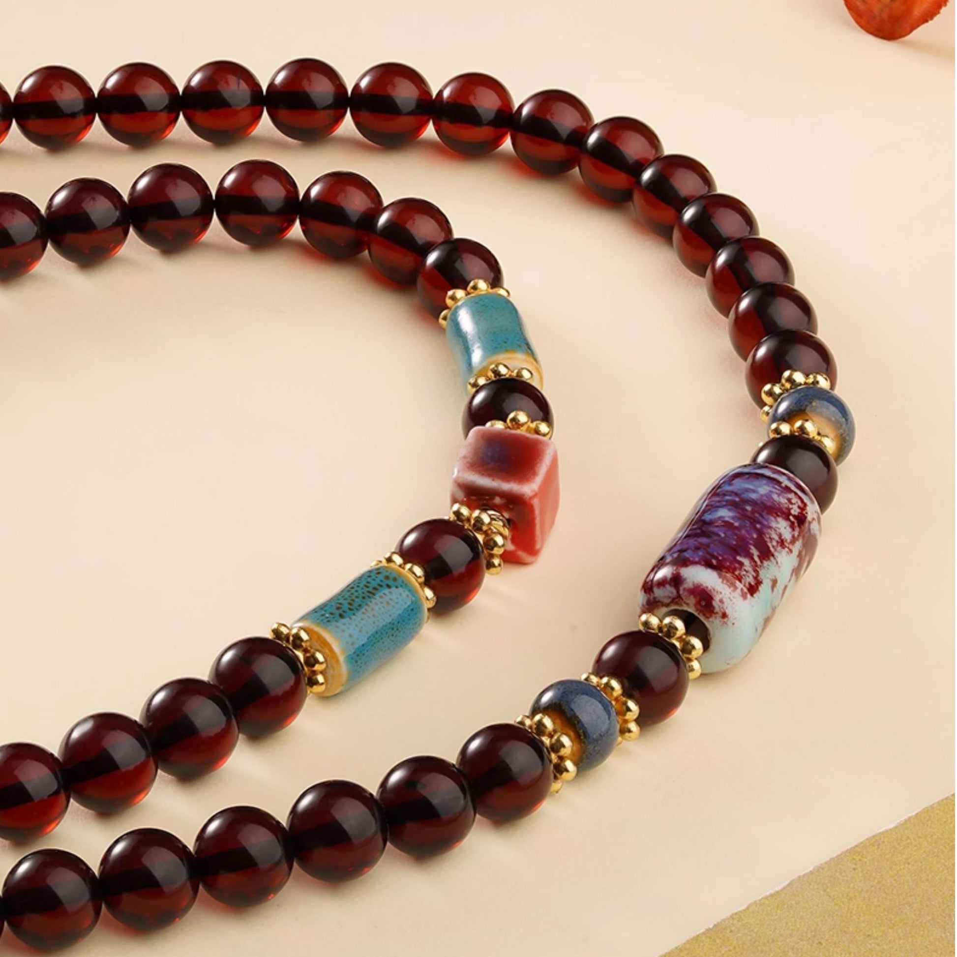 Tibetan Buddhist prayer necklace made of natural blood amber, alloy, and ceramic beads
