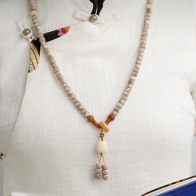 Artisanal Tibetan Bodhi 108 mala featuring starry moon beads and olive nut accents, spiritual jewelry inspired by thangka culture.