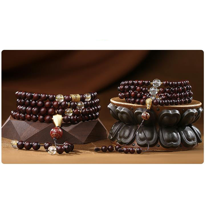 Tibetan Buddhist mala featuring fine sandalwood beads green phantom crystal and silver three way connector