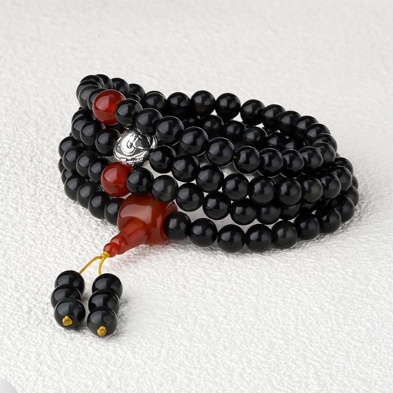 Tibetan Buddhist rainbow obsidian mala featuring 108 beads with silver elephant deity charm.