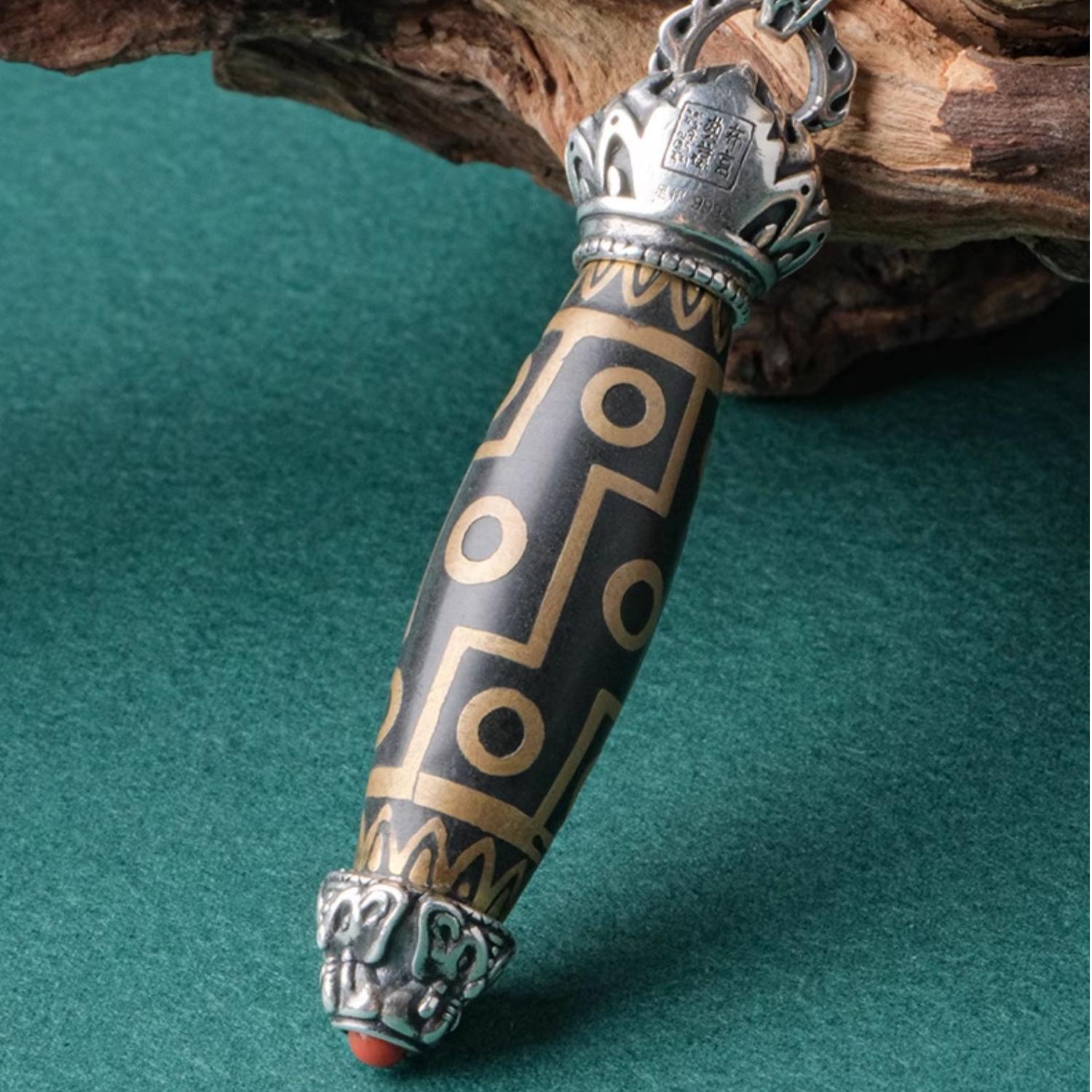 Handcrafted Tibetan Buddhist incense ash twelve-eyed Dzi bead pendant with silver chain.