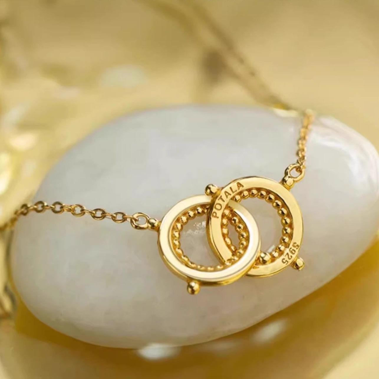 "Tibetan Buddhist-inspired 925 silver and 18K gold necklace, representing harmony and unity through nature and friendship."