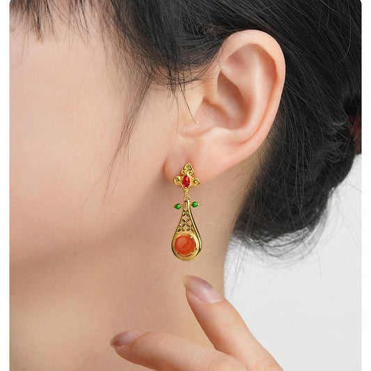 South red agate and sterling silver earrings handcrafted in Tibetan Buddhist style.