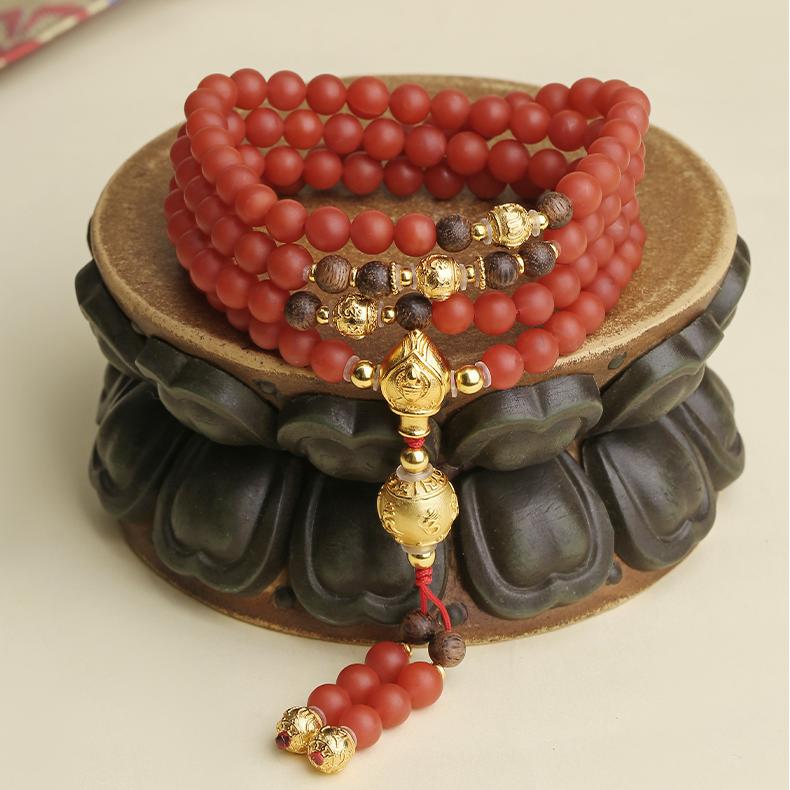 Handmade Tibetan Buddhist 108-bead necklace made from Baoshan red agate, agarwood, and 925 silver.