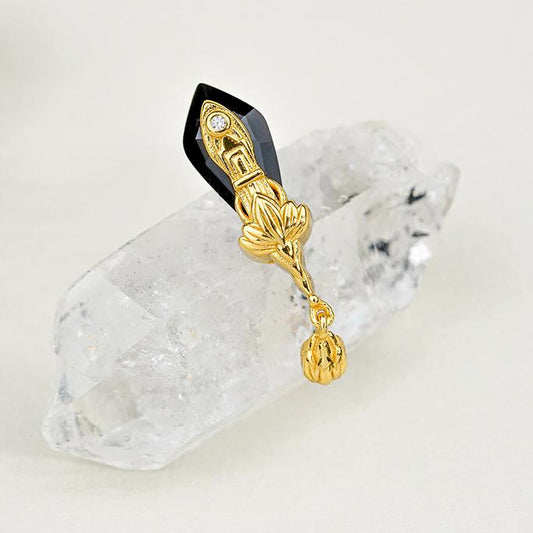 "Tibetan Buddhist-inspired 925 silver ear studs with black agate, representing the sword of wisdom and spiritual protection."