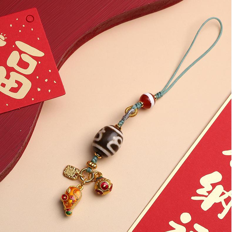 Handmade Tibetan Buddhist Caicai Tianzu pendant with agate beads and copper components.