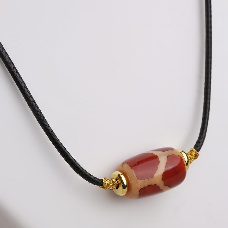 Tibetan Buddhist Qihongrou Tianzu pendant with adjustable cord, featuring copper alloy lotus and red agate.