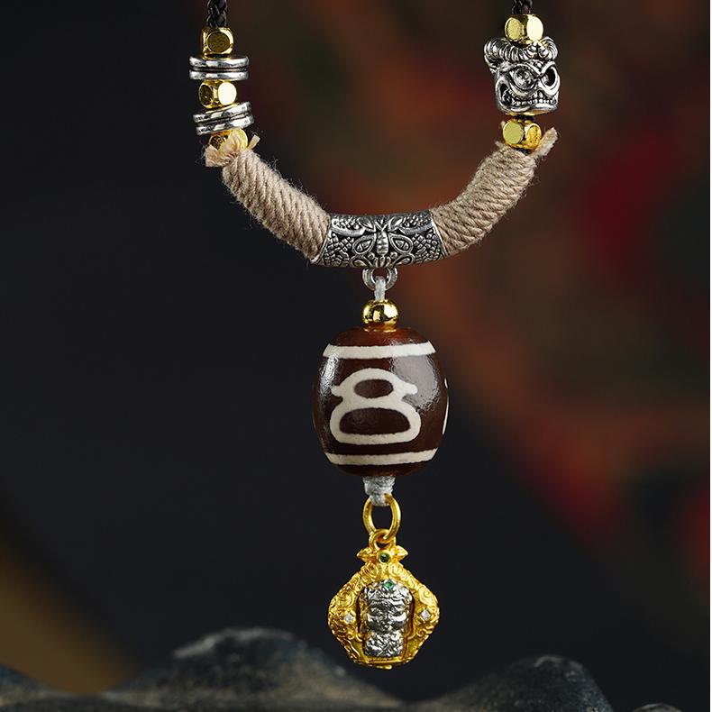 Spiritual Mala necklace featuring a powerful Dzi bead pendant for protection and positive energy.

