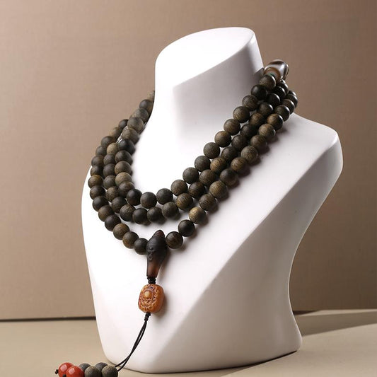Handmade Tibetan Buddhist 108 agarwood and bone beads necklace with silver and red agate for meditation.