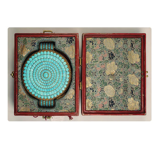 Tibetan Buddhist jewelry featuring turquoise, red agate, and agarwood beads for spiritual grounding and balance.