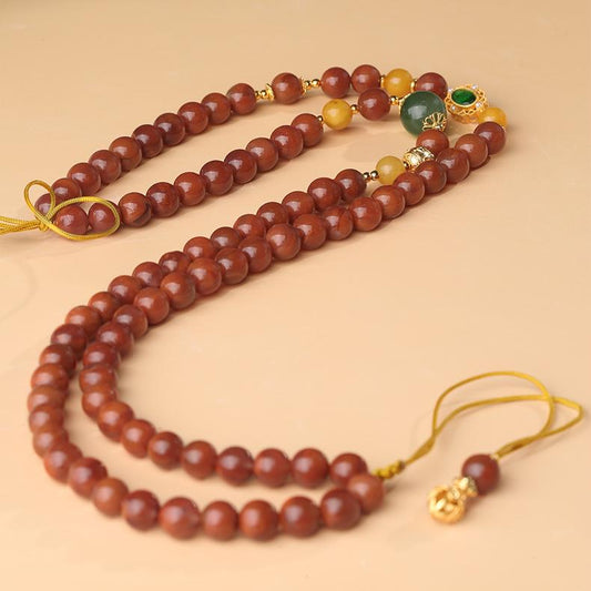 Southern Red Jade and amber necklace with silver accents, inspired by Tibetan jewelry artistry.