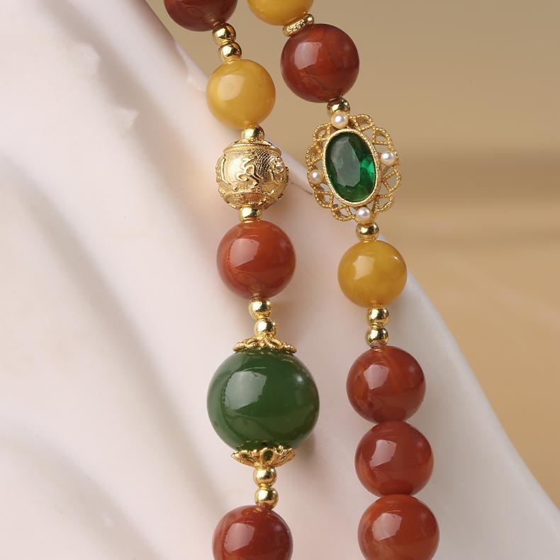 Handmade Tibetan amber and agarwood pendant necklace for spiritual grounding and prosperity.