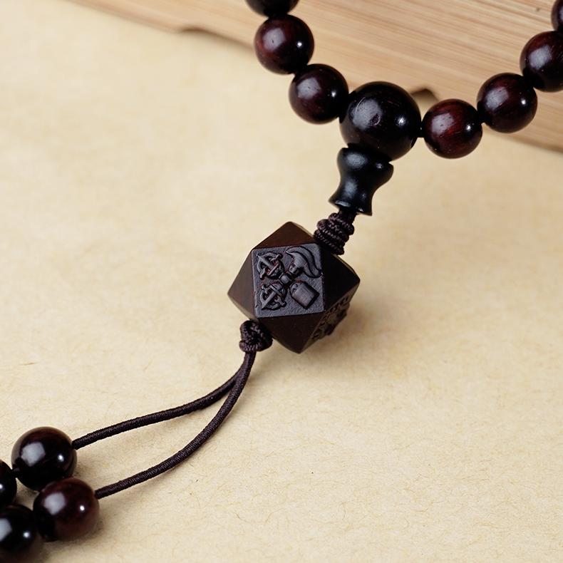 Red sandalwood Dzi mala representing courage, purification, and spiritual focus