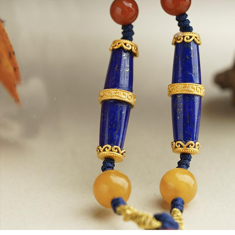 Xiangyang amber pendant with lapis lazuli, spiritual Tibetan jewelry art.