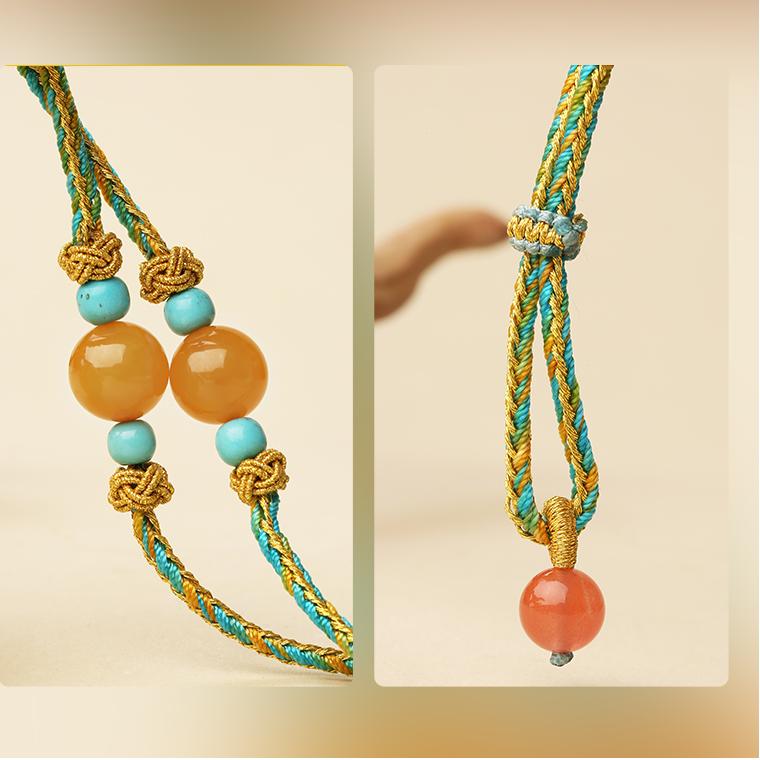 Handcrafted Tibetan Buddhist amber and Dzi bead pendant, combining sacred design and natural beauty